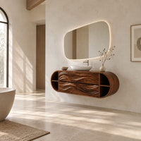 Oval floating cabinet with four carved wave panels and open end shelves in a bright open plan bathroom