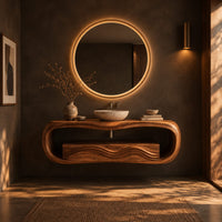 Oval loop bathroom vanity with a carved wave front in a dark bathroom at golden hour
