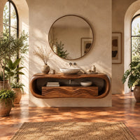 Oval loop bathroom vanity with a carved wave front in a bright bathroom with arched windows and plants