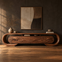 Oval loop frame tv stand with four wave carved fronts in a dark studio against a charcoal plaster wall
