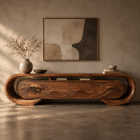 Corner detail of oval loop frame tv stand with four wave carved fronts beside wood, brass and linen samples