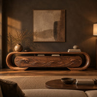 Oval loop frame tv stand with four wave carved fronts in a dark living room at golden hour