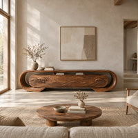 Oval loop frame tv stand with four wave carved fronts in a bright open plan living room