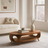 Oval porthole coffee table with a low shelf in an open plan space in daylight