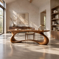 Oval top desk on one continuous ribbon loop base with an open center in a bright open plan home office