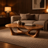 Pebble shaped coffee table on branching legs with open arches in an evening living room with walnut wall paneling