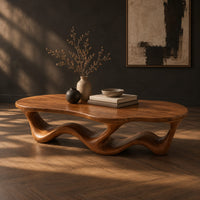 Pebble shaped coffee table with a rippling open ribbon base, three-quarter view showing the grain