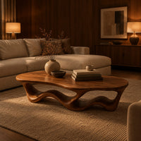 Pebble shaped coffee table with a rippling open ribbon base in an evening living room with walnut wall paneling