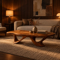 Pebble shaped coffee table with sweeping arched legs in an evening living room with walnut wall paneling