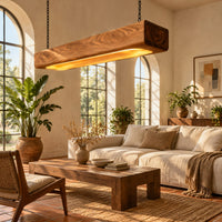 Pendant light shaped as a long wood beam with a warm glowing underside in a bright living room with arched windows and plants