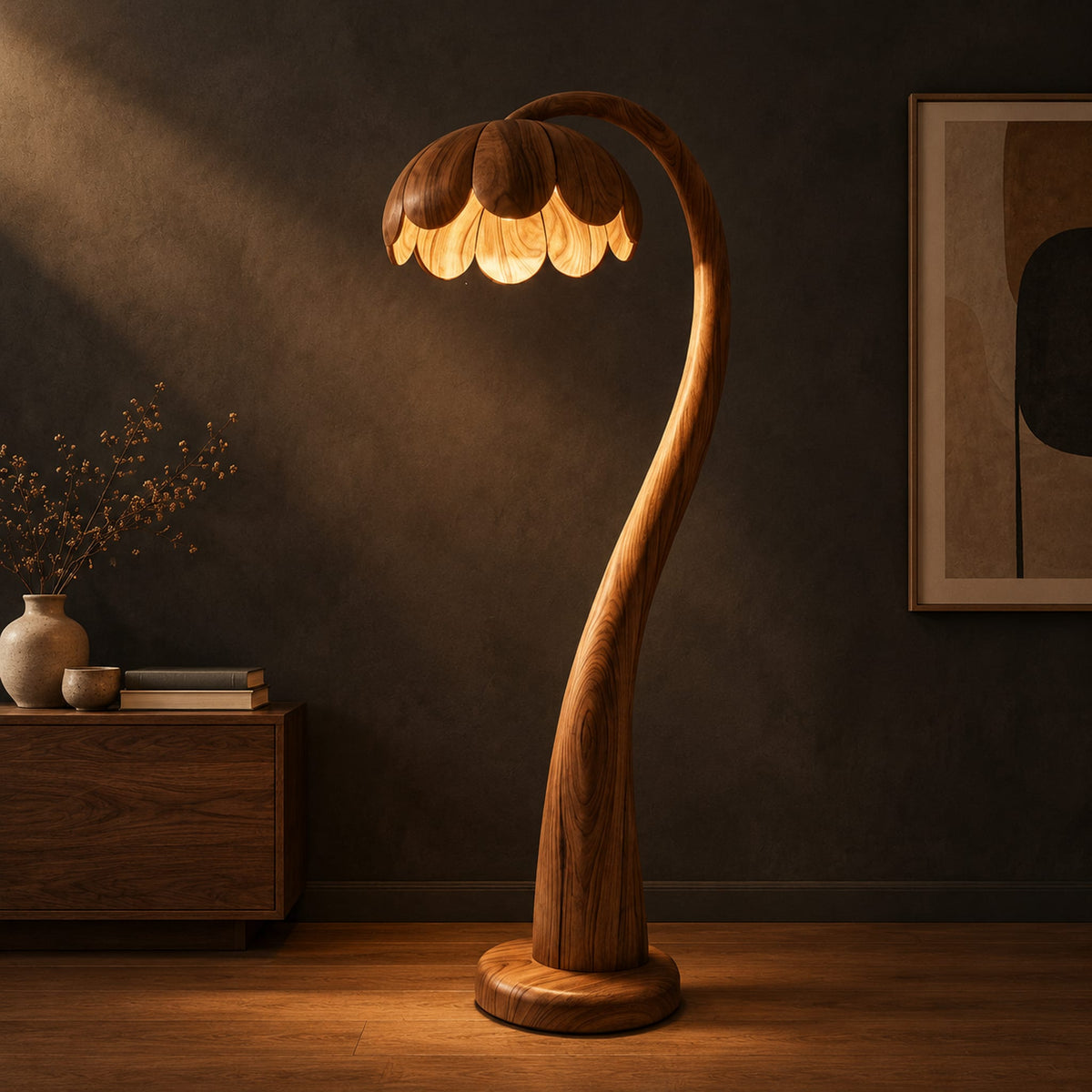 Floor lamp with a flower petal shade on a slender arching stem in a dark studio against a charcoal plaster wall