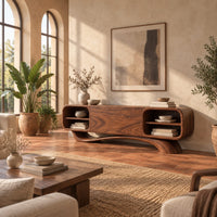 Low pill shaped media cabinet with open end shelves on a sweeping wave base in a bright living room with arched windows and plants