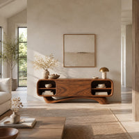 Low pill shaped media cabinet with open end shelves on a sweeping wave base in a bright open plan living room