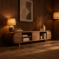 Pill shaped tv stand with open shelf bays and panel fronts in an evening living room with walnut wall paneling