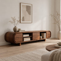 Pill shaped tv stand with open shelf bays and panel fronts in a Scandinavian living room with white walls