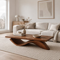 Rectangular coffee table with a flat plank top on a single rolling wave base in a Scandinavian living room with white walls