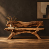 Bench with a live edge slab back, a flat slab seat and arched legs in a dark studio against a charcoal plaster wall