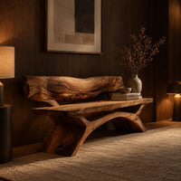 Bench with a live edge slab back, a flat slab seat and arched legs in an evening entryway with walnut wall paneling