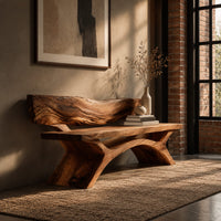 Bench with a live edge slab back, a flat slab seat and arched legs in an industrial loft entryway with exposed brick