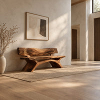 Bench with a live edge slab back, a flat slab seat and arched legs in a bright open plan entryway