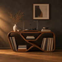 Low record console with a looping ribbon frame and open end bays in a dark studio against a charcoal plaster wall