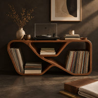 Corner detail of low record console with a looping ribbon frame and open end bays beside wood, brass and linen samples