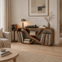 Low record console with a looping ribbon frame and open end bays in a Scandinavian living room with white walls