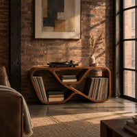 Low record console with a looping ribbon frame and open end bays in an industrial loft living room with exposed brick