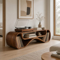 Long low record console with rolled ends and a wave shaped lower edge in a Scandinavian living room with white walls