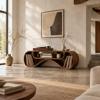 Long low record console with rolled ends and a wave shaped lower edge in a bright open plan living room