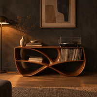 Record console with a twisting figure eight frame and two open bays in a dark living room at golden hour