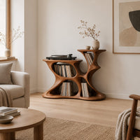 Sculpted organic record player stand with open pockets and two top levels in a Scandinavian living room with white walls
