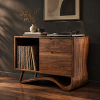 Record player stand with an open side bay and a sweeping ribbon base, three-quarter view showing the grain