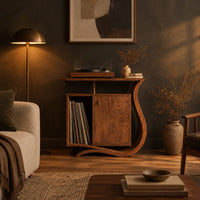 Record player stand with a ribbon base, a side slot and a raised top in a dark living room at golden hour
