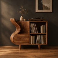 Record player stand with a flowing wave side and two open cubbies in a dark studio against a charcoal plaster wall