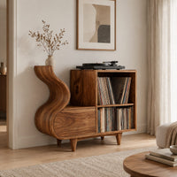 Record player stand with a flowing wave side and two open cubbies in a Scandinavian living room with white walls
