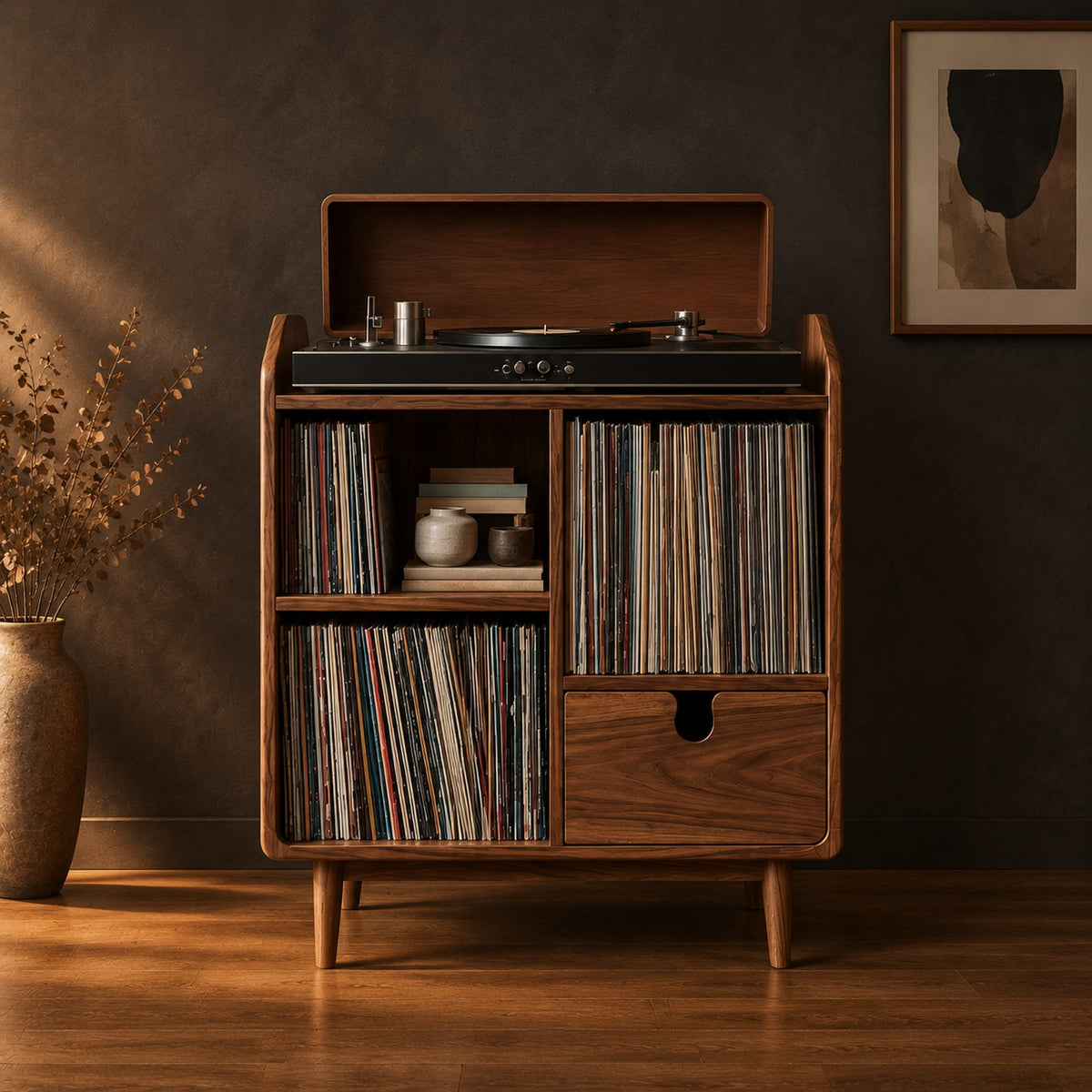 Wood record player stand on tapered legs with open cubbies and a drawer in a dark studio against a charcoal plaster wall