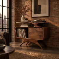 Record player stand with a winged top shelf, open bay and splayed legs in an industrial loft living room with exposed brick