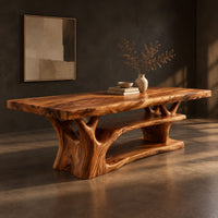 Rectangle dining table on a branching tree trunk base, three-quarter view showing the grain