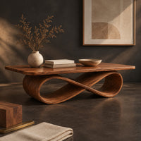 Corner detail of rectangular wooden coffee table on a figure eight ribbon base beside wood, brass and linen samples