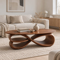 Oval coffee table over layered looping ribbons shaped like an infinity symbol in a Scandinavian living room with white walls