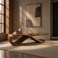 Low ribbon bench with a looping base and a long flat top in an industrial loft entryway with exposed brick