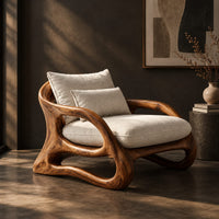 Lounge chair with a looping wooden ribbon frame and cream cushions, three-quarter view showing the grain
