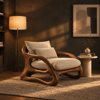 Lounge chair with a looping wooden ribbon frame and cream cushions in a dark living room at golden hour