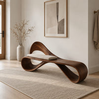 Ribbon loop bench with an arched backrest and a cream cushion in a Scandinavian entryway with white walls