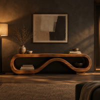 Low tv stand shaped as a rolling ribbon loop in a dark living room at golden hour