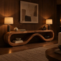 Low tv stand shaped as a rolling ribbon loop in an evening living room with walnut wall paneling