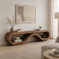 Low tv stand shaped as a rolling ribbon loop in a Scandinavian living room with white walls