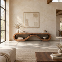 Low tv stand shaped as a rolling ribbon loop in a bright open plan living room