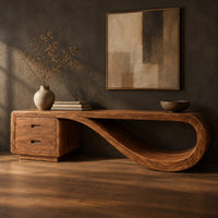 Corner detail of low tv stand with two drawers and a ribbon shaped looping end beside wood, brass and linen samples